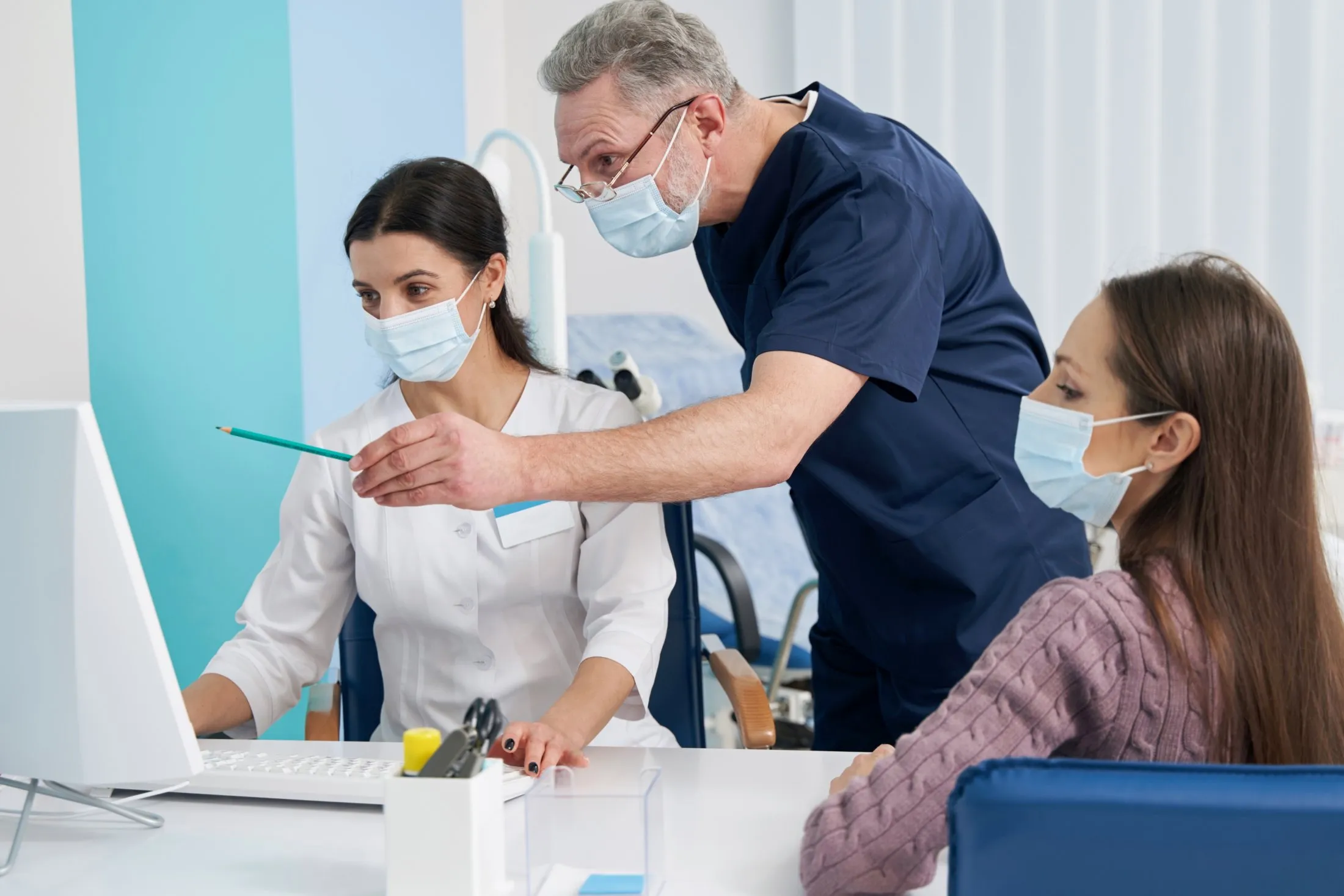 Oral surgeon discussing a personalized surgical treatment plan with a patient during an in-office consultation.