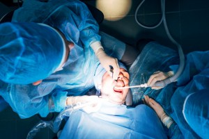 Team of dental surgeons working in a Premier Oral and Maxillofacial Surgery Group clinic.