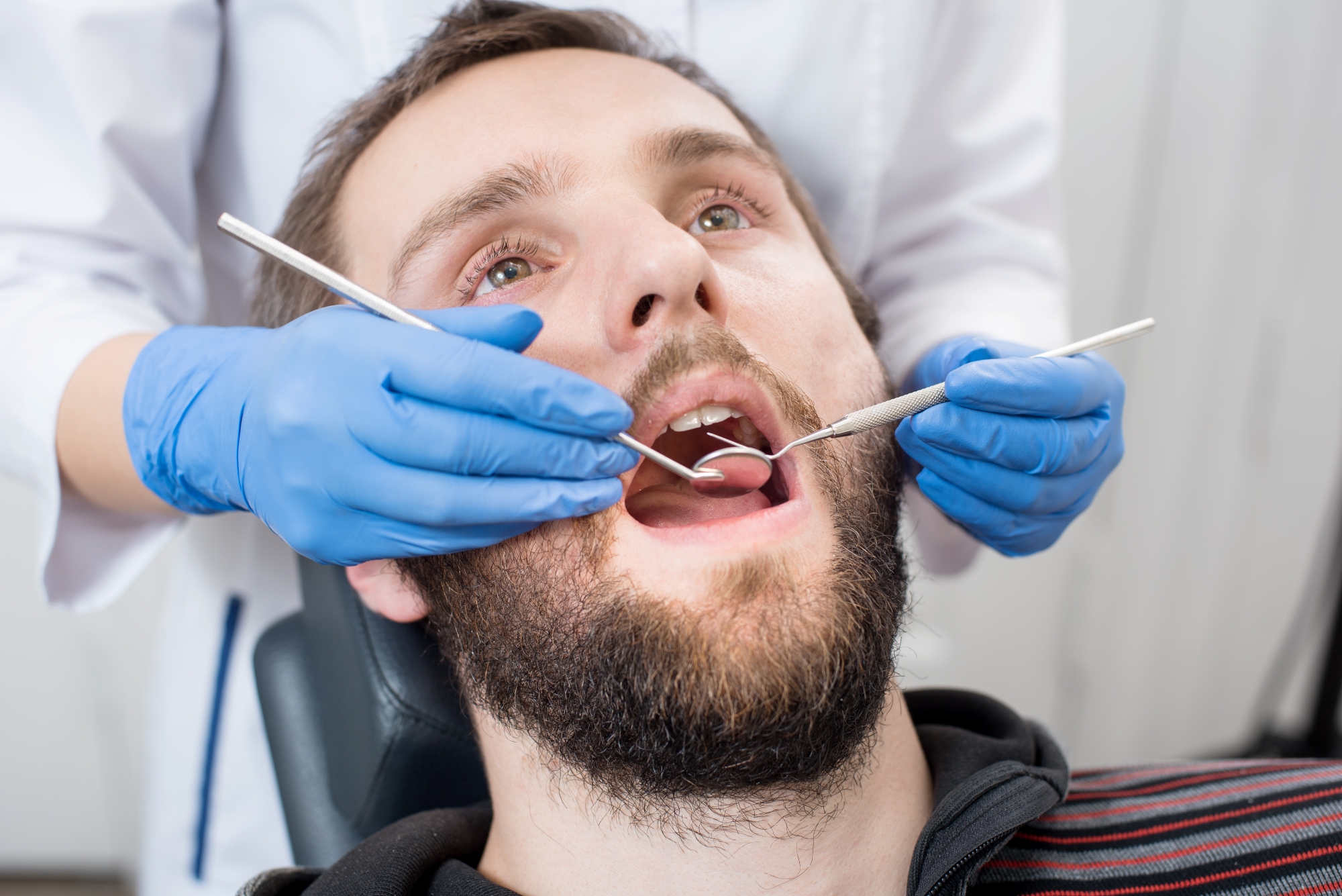 Close-up of a man having a dental check-up.