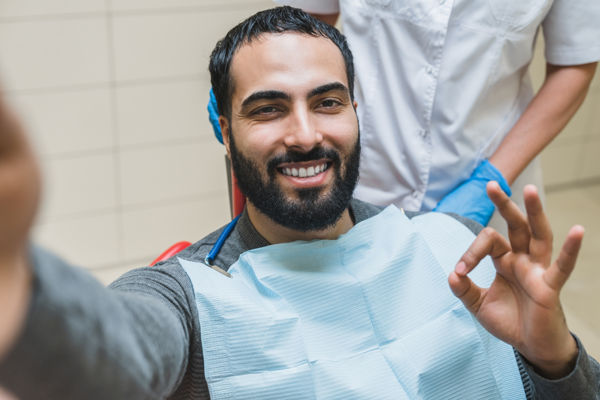 A satisfied patient after oral surgery at Premier Oral and Maxillofacial Surgery Group.