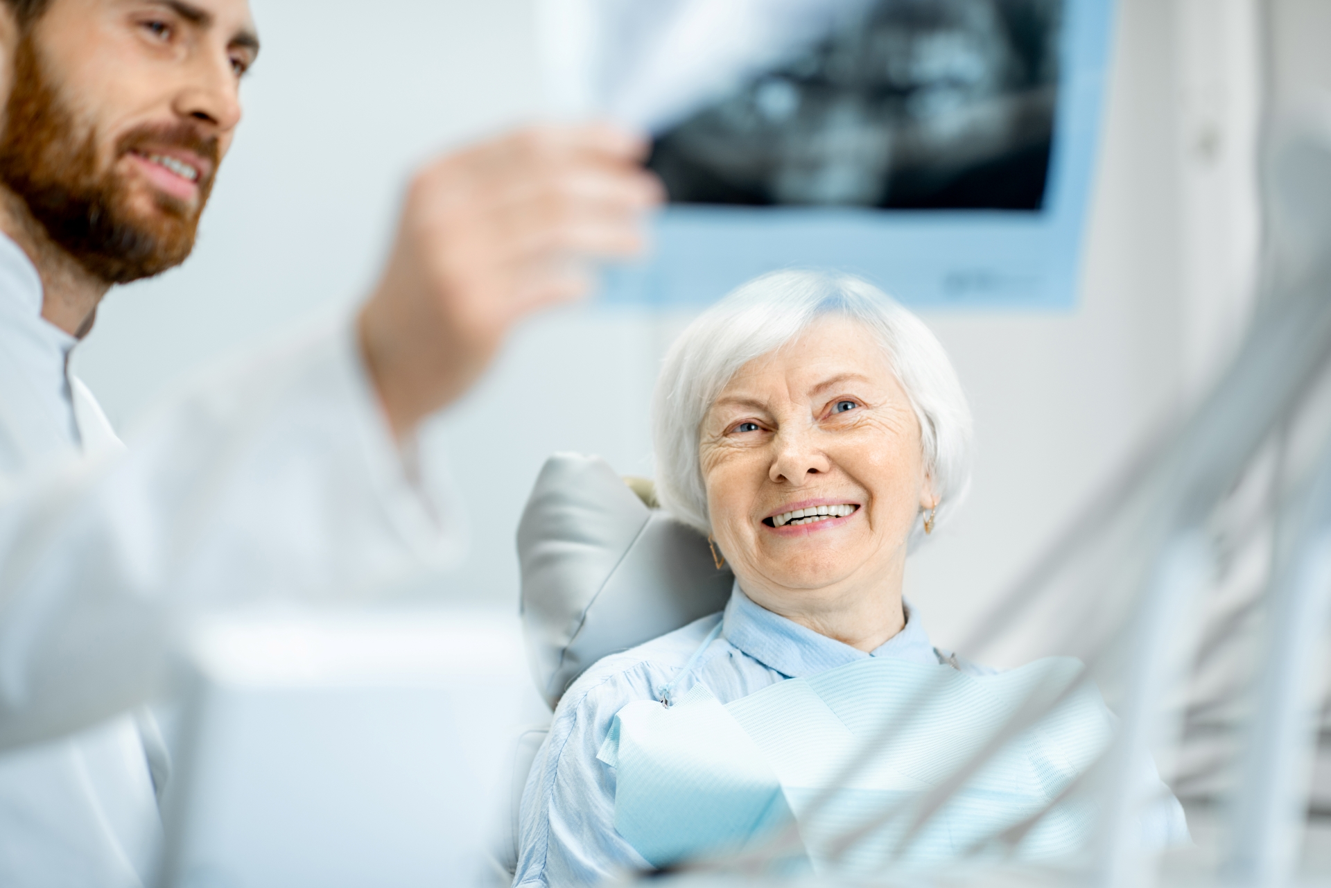 An older female patient after a successful surgery at Premier Oral.