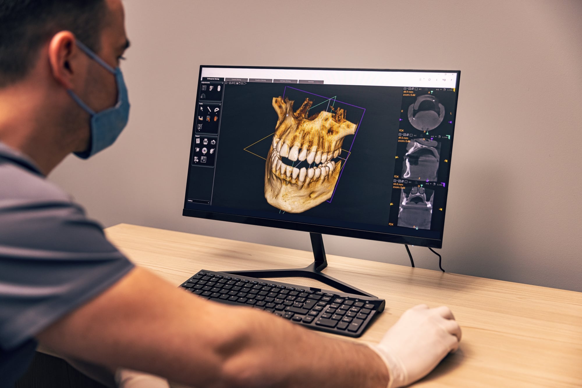 Oral surgeon reviewing dental X-ray with patient during consultation at Premier Oral.