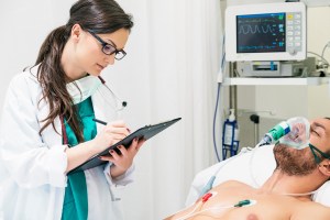 Oral surgeon speaking with a patient during consultation at Premier Oral.